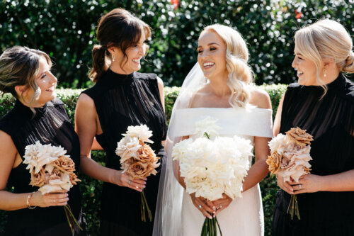 Modern wedding dress and bridesmaids ideas with simple floral bouquets